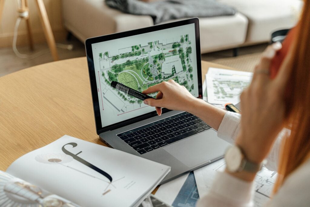 pexels photo 5243989 5243989 1 Architect reviewing landscape design on laptop, enhancing architectural projects from home office.