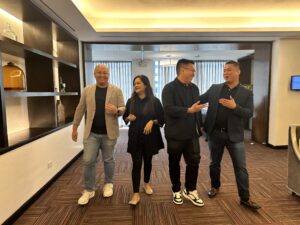 Mira leaders walking in the office, talking to each other, smiling